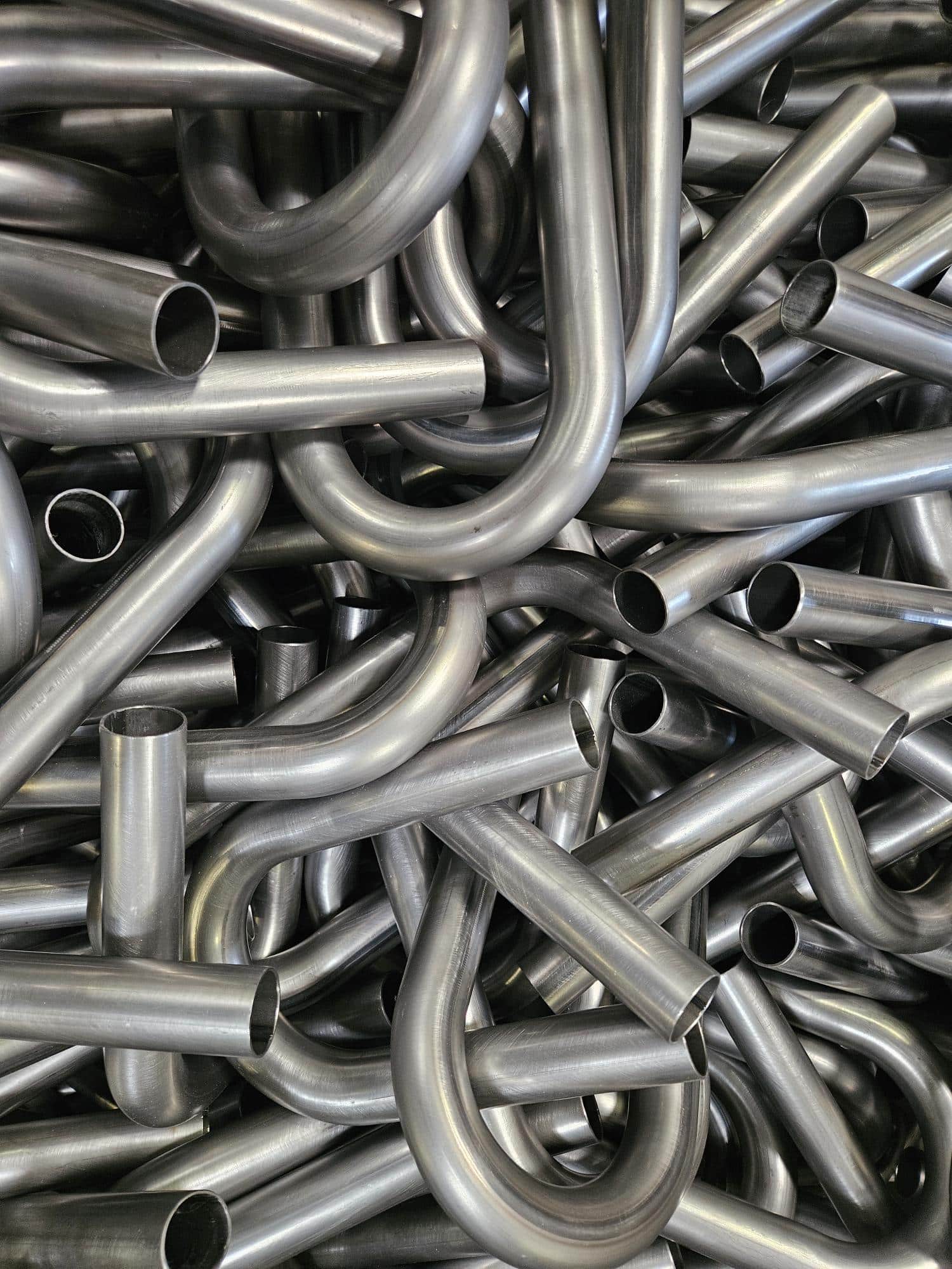 A bin of formed tube bends