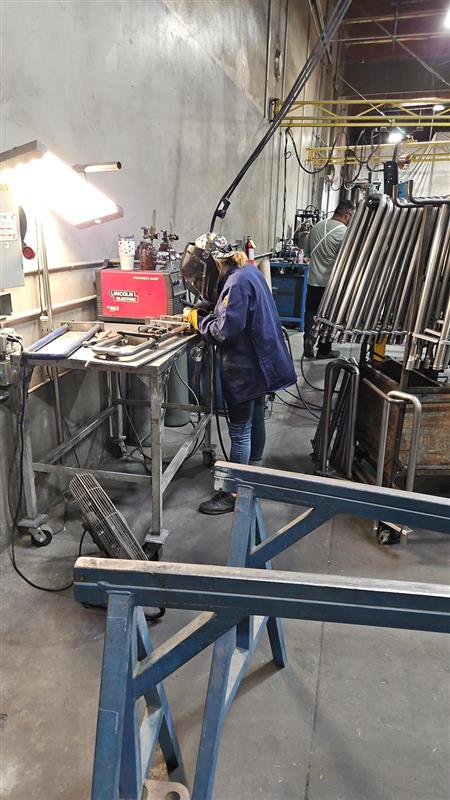 Tube fabrication work at a welding station